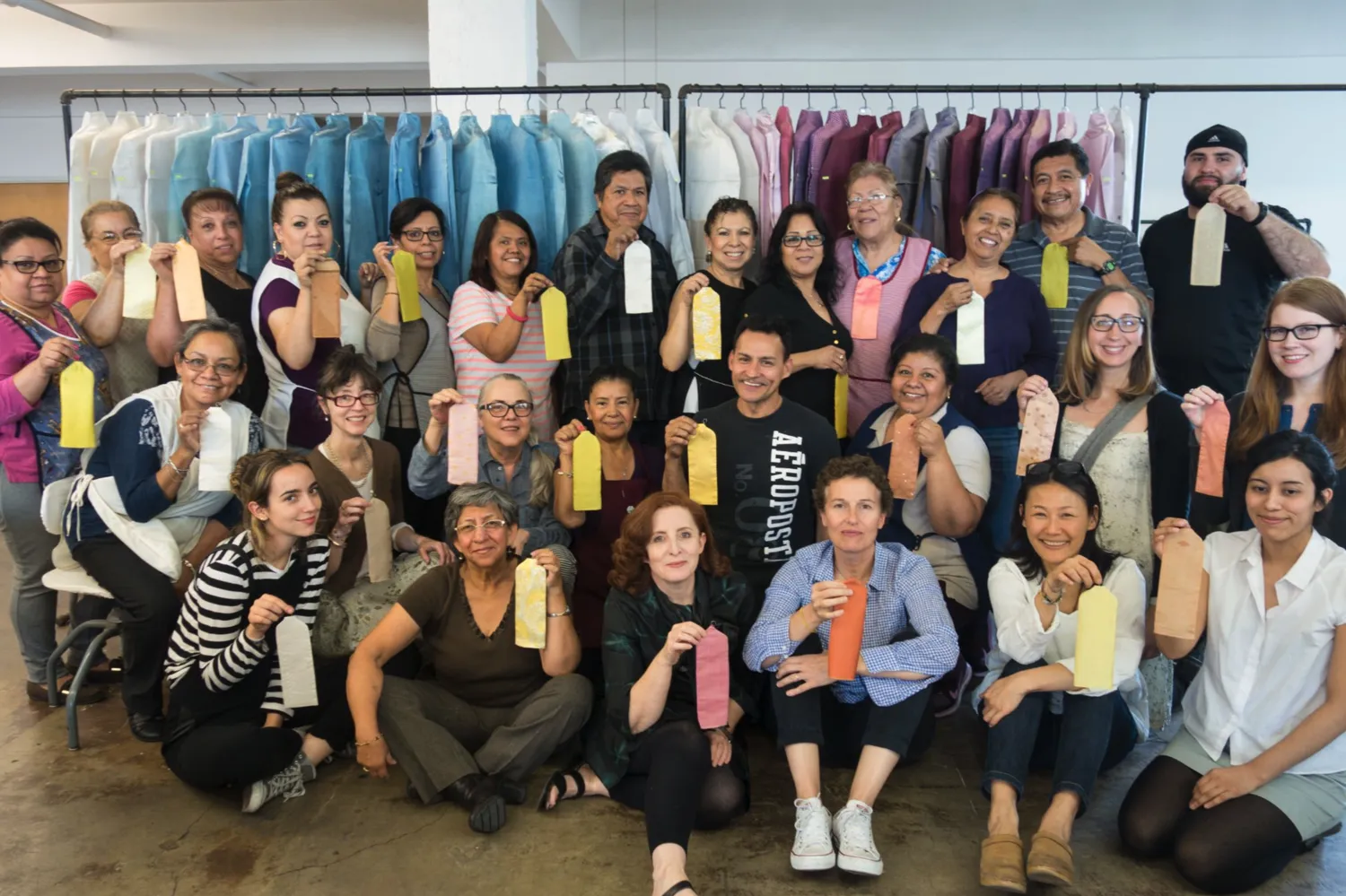 dosa team in front of field of color: indigo—dyed using indigo and chebulic myrobalan, and field of color: caracol/tyrian purple—dyed with lac and himalayan rhubarb