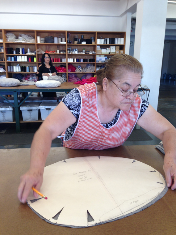 Obdulia marks Shigeki's pattern on to fabric