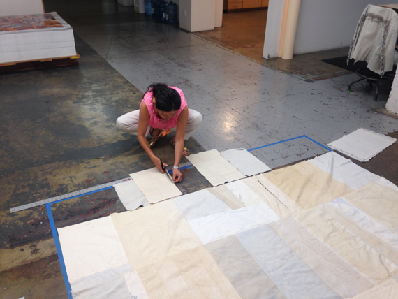 laying out patchwork for 7'x7’ floor pillow