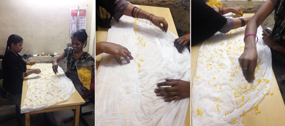 scattering and folding marigold petals into the fabric
