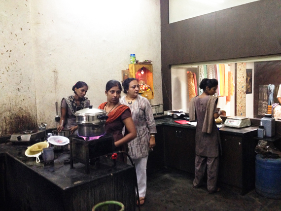 Rupa and artisans wait during steaming