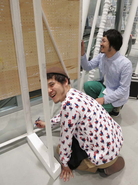 DSMG employees touching up details with white-out